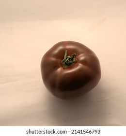 Heirloom tomato:  Black variety isolated.
