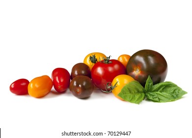 Heirloom Tomatoes With Fresh Basil, Isolated On White.