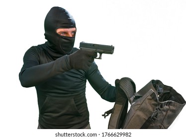 Heist And Robbery - Hollywood Style Portrait Of Man In Balaclava Mask Holding Gun In Front Of Security Metal Vault Door In Bank Or Casino Heist Concept Stealing Money Unlocking Safe