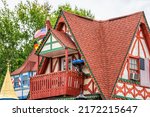 Helen, Georgia Bavarian village traditional architecture house building closeup for Helen square on Main street with red roof tiles and American flag
