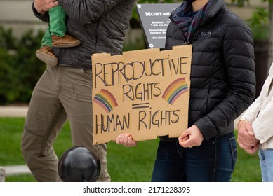 Helena, Montana - June 24, 2022: Woman holding reproductive rights are human right sign at state capitol to protest overturning roe vs wade by SCOTUS making abortion illegal