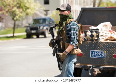 Helena, Montana - May 20, 2020: An Armed Man, Militia Member, Protest At The Capitol Building, Holding A Semi-automatic Weapon In A Street At The Capitol, Member Of The Continentals With A Gun.