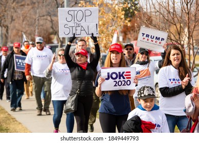 Helena, Montana / Nov 7, 2020: Pro Trump supporters at Stop the Steal rally holding signs against the media declaring Joe Biden President elect due to voter fraud and vote count being incomplete.