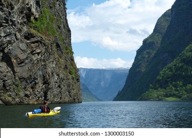 Helgeland / Norway - May 13 2013: Man Kayaking Alone Through Spectacular Norwegian Fjord On Summer Day.