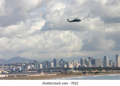 helicopter ascending away from city