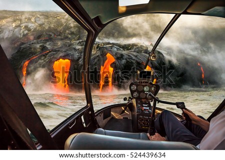 Helicopter cockpit flies in Kilauea Volcano, Big Island, Hawaii, United States by sunset, with pilot arm and control board inside the cabin.