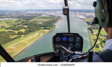 Helicopter Flight. View From The Cockpit With The Pilot And Flight Instruments.