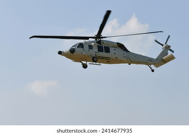 Helicopter flying attack armed force four blades  rotor black hawk. 