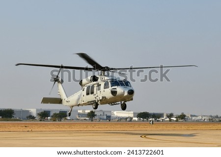 Helicopter flying attack armed force four blades  rotor black hawk. 