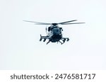 Helicopter is flying in a isolated sky