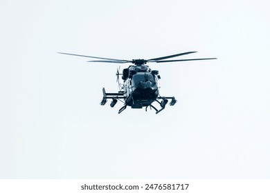 Helicopter is flying in a isolated sky