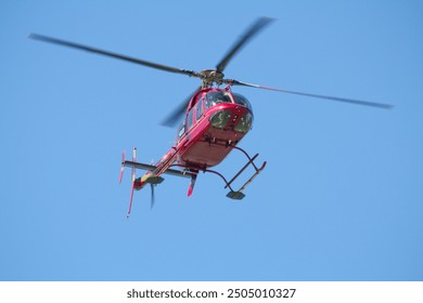 Helicopter flying over the beach at Sanibel Island.