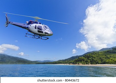 Helicopter flying over deserted Island in Angra dos Reis, Rio de Janeiro - Powered by Shutterstock