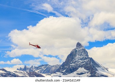 Helicopter Flying Over Snowy Matterhorn Peak, Switzerland