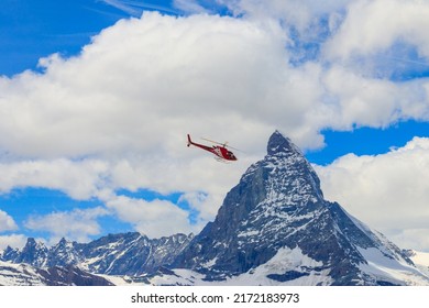 Helicopter Flying Over Snowy Matterhorn Peak, Switzerland