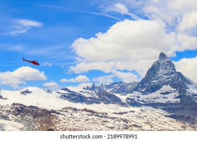 Helicopter Flying Over Snowy Matterhorn Peak, Switzerland