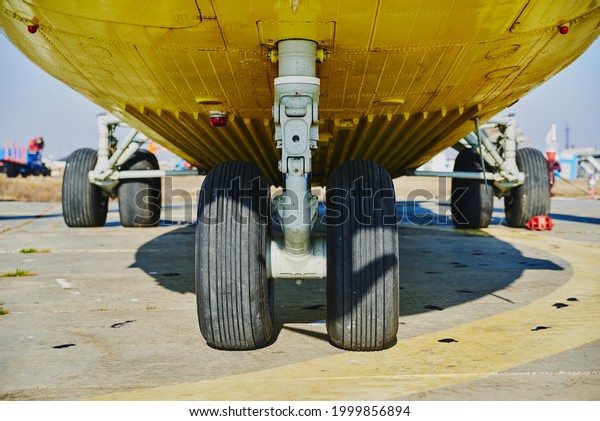 Helicopter\
landing gear with aircraft thrust pad. Landing gear of military\
helicopter. Wheel Of Airplane Or\
Helicopter.
