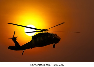 Helicopter Landing At Sunset