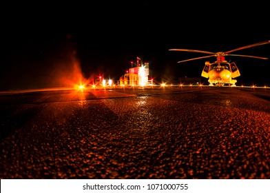 Helicopter On Helipad At Night