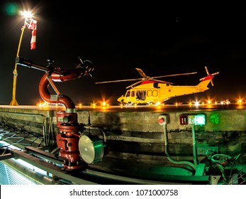 Helicopter On Helipad At Night