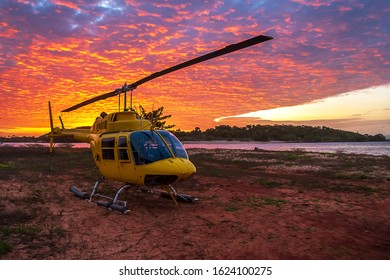 Helicopter On The Land Next To The Sea At Sunset, Australia, Northern Territory, Seisia Cape York