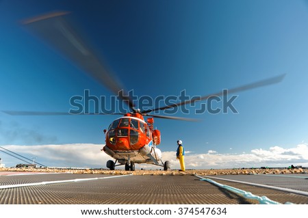 Helicopter on the upper deck of the sea oil production platform, Sakhalin, Russia