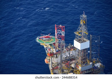 helicopter pick up passenger on the offshore oil rig platform in gulf of thailand