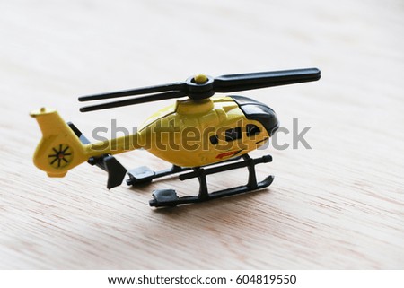 Helicopter toy yellow color on the floor