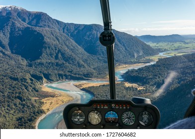 Helicopter window view of mountain valley with river. Luxury tourism, travel experience background  - Shutterstock ID 1727604682