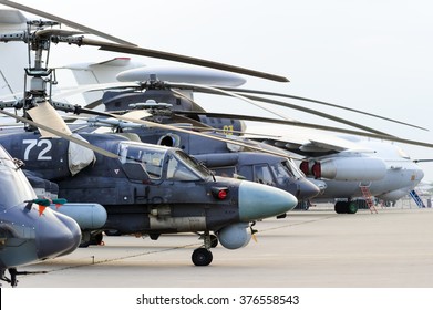 Helicopters And Planes In Row, Military Copters And Bomber Jets And Reconnaissance Aircrafts, Air Force, Modern Army Aviation And Aerospace Industry 