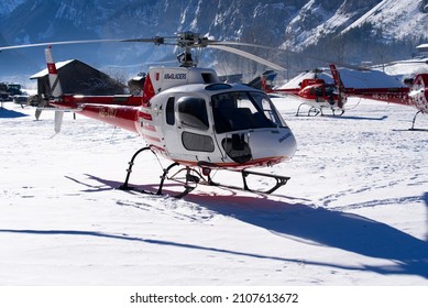 Helicopters type Eurocopter AS350 B3 Ecureuil at heliport of Air Glaciers at Mountain Village Lauterbrunnen. Photo taken January 15th, 2022, Lauterbrunnen, Switzerland.