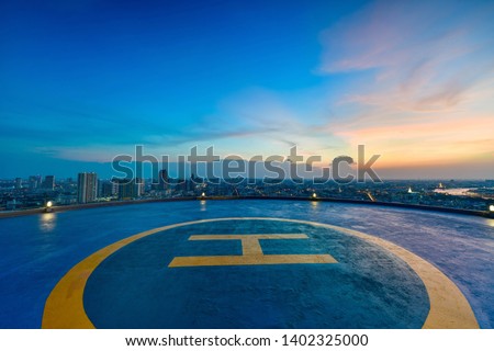 Heliport backdrop of the city at sunset