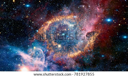 The Helix Nebula is a large planetary nebula located in the constellation Aquarius. Elements of this image furnished by NASA.