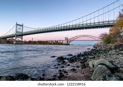 Hell Gate Bridge and Triborough Bridge at night, in Astoria, Queens, New York. USA
