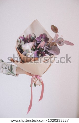 Similar – Bouquet with greeting card and candle