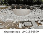 Hellenistic theatre remains -cavea, proscenium, orchestra- dated in the mid-III c.BC thanks to the dedicatory inscription, and some others on the diazoma, Butrint archaeological site. Sarande-Albania.