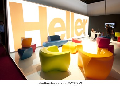 Heller Creative Design Booth Stand At Furniture Mobile Fair Event 2011 In Milan, Italy On April 13, 2011. Exhibitors And Visitors Doing Business, Colorful Sofas And Chairs.