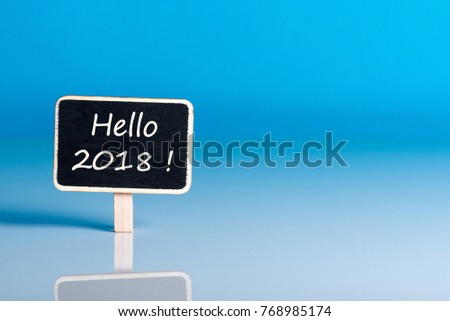 Hello 2018 New Year - text on little tag at blue background with empty space for card, mockup