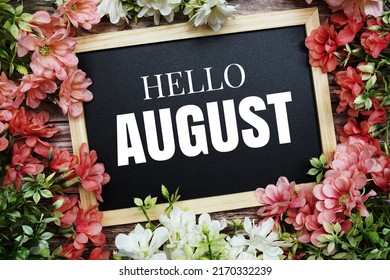 Hello August typography text written on wooden blackboard with flower bouquet decorate on wooden background - Shutterstock ID 2170332239