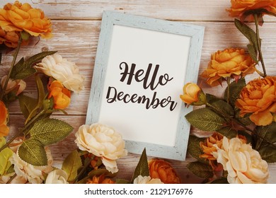 Hello December typography text with flower decoation on wooden background - Powered by Shutterstock