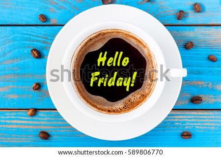 Hello Friday Morning Coffee mug at blue wooden background. Good day concept