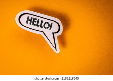 Hello. Greetings, Kindness And Hospitality Concept. Speech Bubble On Yellow Background.