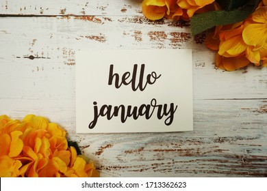 Hello January Card with Blooming flower on wooden background - Powered by Shutterstock