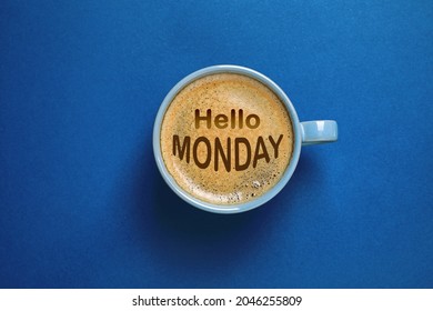 Hello Monday, start your week with good mood. Cup of freshly brewed aromatic coffee on blue background, top view - Powered by Shutterstock