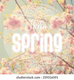 Hello Spring Text With Out Of Focus Spring Background.