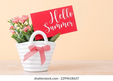 Hello summer on red card with flowers bouquet in vase.