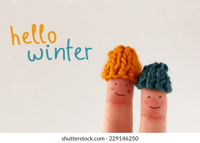 Hello Winter - Smiling Finger People Couple With Red Cheeks Wearing Knitted Woolen Hats