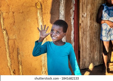 Hello World Happy African Child Waving And Greeting The Guests In Her Village In Botswana