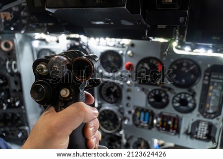 helm of a military helicopter in the pilot's hand. fighter pilot. Inside the attack aircraft.