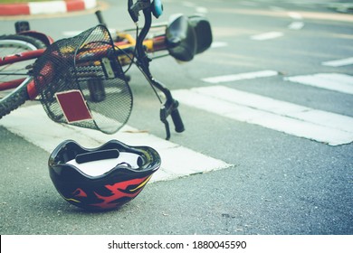 Helmet And Bike Lying On The Road On A Pedestrian Crossing, After Accident